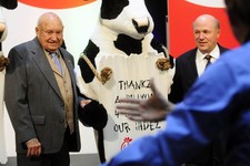  - 
              FILE - In this Monday, Dec. 14, 2009 file picture, Chick-fil-a founder Truett Cathy, left, and his son Dan Cathy pose for a photo with the Chick-fil-A cows during a celebration of passi