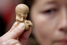  - 
              A protester opposed to abortion demonstrates outside the Marie Stopes clinic in Belfast, Northern Ireland, Thursday, 18, 2012. The first abortion clinic on the island of Ireland has ope