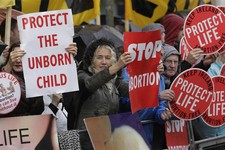  - 
              Protesters opposed to abortion hold placards outside the Marie Stopes clinic in Belfast, Northern Ireland, Thursday, 18, 2012. The first abortion clinic on the island of Ireland has ope