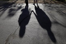  - 
              This Sept. 20, 2012 photo shows the shadows of a young woman from Rockford, Ill., left, with her husband. When her doctor said a medical condition made her unplanned pregnancy too risky