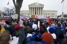  - 
              FILE - In this Jan. 23, 2012 file photo, anti-abortion and abortion rights supporters stand face to face in front of the Supreme Court in Washington, Monday, Jan. 23, 2012, during the a