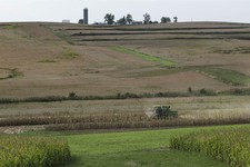  - 
              In this September 2012 photo provided by the Iowa Farm Bureau, farmer Randy Dreher uses a combine to harvest one of his corn fields north of Audubon, Iowa. Dreher says agriculture is en