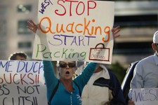  - 
              Linda McSpadden demands that U.S. Rep. Allen West, R-Fla., stop his battle for his congressional seat, Florida's 18th District, outside the Palm Beach Circuit Court House in West Palm B