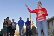  - 
              FILE - In a Monday, Nov. 5, 2012 file photo, former Democratic Arizona State Sen. and Arizona congressional candidate Kyrsten Sinema addresses residents in a neighborhood in Mesa, Ariz.