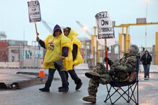  - 
              Port workers represented by SEIU Local 1021 take part in a 24-hour strike at the Port of Oakland in Oakland, Calif.,  in the early morning hours on Tuesday, Nov. 20, 2012   (AP Photo/Th