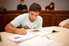  - 
              In this photo provided by Adrian College, students work at the main lecture hall in the school's center for communication and media arts in Adrian, Mich. For today’s increasingly career