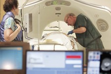  - 
              FILE - In this June 3, 2010 file photo, Dr. Steven Birnbaum works with a patient in a CT scanner at Southern New Hampshire Medical Center in Nashua, N.H. The American Cancer Society say
