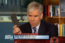  - 
              This video frame grab image provided by"Meet the Press" shows host David Gregory holding what he described as a high-capacity ammunition magazine during a recent Sunday's program.  Greg