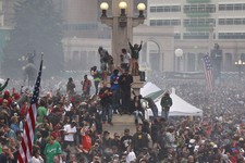  - 
              Members of a crowd numbering tens of thousands smoke marijuana and listen to live music, at the Denver 420 pro-marijuana rally at Civic Center Park in Denver on Saturday, April 20, 2013