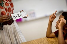  - 
              In this Thursday, April 18, 2013 photo, Burgess-Peterson Elementary School second grader Carl Hood, right, sits through a lesson with instructor Lola Onikoyi as part of Atlanta Public S