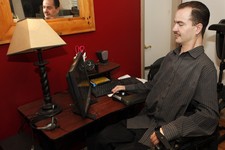  - 
              FILE - In this Dec. 6, 2012 file photo, Brandon Coats works on his computer at his home in Denver. Coats, a quadriplegic medical marijuana patient, was fired from his job in 2010 as a t