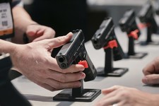  - 
              FILE - In this Wednesday, Jan. 16, 2013 file photo, a Glock representative explains features of the Glock 37 Gen 4 .45 caliber pistol at the 35th annual SHOT Show, in Las Vegas. After s