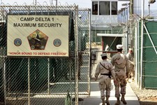  - 
              FILE -  In this June 27, 2006 file photo, reviewed by a US Department of Defense official, US military guards walk within Camp Delta military-run prison, at the Guantanamo Bay US Naval 
