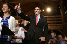  - 
              Republican candidate for the U.S. Senate Gabriel Gomez, center, gives a thumbs up as he takes to the stage next to his daughter Olivia, 13, left, before addressing an audience with a vi
