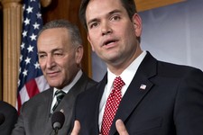  - 
              FILE - In this Jan. 28, 2013 file photo, Sen. Marco Rubio, R-Fla., right, accompanied by Sen. Charles Schumer, D-N.Y., gestures as he speaks during a bipartisan group of leading senator