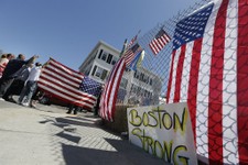  - 
              Protesters gesture and hold a flag outside the Graham, Putnam, and Mahoney Funeral Parlors in Worcester, Mass., Monday, May 6, 2013, where the body of killed Boston Marathon bombing sus