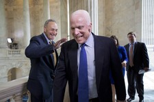  - 
              Sen. John McCain, R-Ariz., laughs as he and Sen. Chuck Schumer, D-N.Y., left, cross paths at competing TV news interviews just before a vote in the Senate on legislation to collect sale
