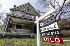  - 
              In this Tuesday, April 9, 2013, photo, a "Sold" sign is posted outside a home in Indianapolis. Mortgage giant Freddie Mac earned $4.6 billion from January through March of 2013, helped 