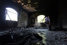  - 
              FILE - In this Thursday, Sept. 13, 2012 file photo, a Libyan man investigates the inside of the U.S. Consulate after an attack that killed four Americans, including Ambassador Chris Ste
