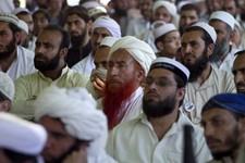  - 
              In this Thursday, May 2, 2013 photo, Supporters of a pro-Taliban religious group Jamiat-e-Ulema Islam (JUI-F), listen to their leader Maulana Shujaul Mulk, not pictured, during his an e