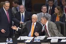  - 
              From left, Sen. Chuck Schumer, D-N.Y., standing, Sen. Orrin G. Hatch, R-Utah, and Sen. Chuck Grassley, R-Iowa, confer as the Senate Judiciary Committee meets on immigration reform on Ca