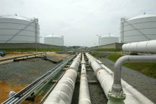  - 
              FILE - This June 13, 2003 file photo shows pipelines running from the offshore docking station to four liquefied natural gas (LNG) tanks at the Dominion Resources Inc. Liquefied Natural