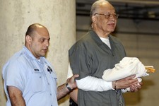  - 
              Dr. Kermit Gosnell is escorted to a waiting police van upon leaving the Criminal Justice Center in Philadelphia, Monday, May 13, 2013, after being convicted of first-degree murder in th