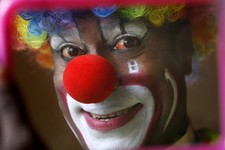  - 
              In this April 11, 2013 photo, Biju Nair, principal clown at Rambo Circus, looks at a mirror before a performance on the outskirts of Mumbai, India. Nair who literally ran away and joine