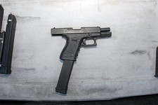  - 
              In this image released by the Pima County Sheriff's department, weapons including guns and knives are seen in the aftermath of the Tucson shooting rampage that killed six people and wou