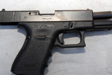  - 
              In this image released by the Pima County Sheriff's department, a Glock 9 mm pistol is seen in the aftermath of the Tucson shooting rampage that killed six people and wounded former U.S