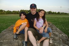  - 
              FILE - This June 2009 photo provided by Christopher Savoie shows him, center, with his son, Isaac, and daughter, Rebecca, at a park near their home in Franklin, Tenn.  The children were