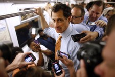  - 
              New York City mayoral hopeful Anthony Weiner speaks to reporters as he rides the subway to a radio appearance on the first day of his campaign, Thursday, May 23, 2013 in New York. Weine