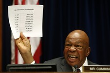  - 
              Rep. Elijah Cummings, D-Md., ranking Democrat on the  House Oversight and Government Reform Committee, holds up a sheet detailing IRS conference spending as he makes opening remarks on 