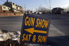  - 
              FILE - In a Friday, Jan. 4, 2013 file photo, a sign is posted for an upcoming gun show, in Leesport, Pa. Nearly six in 10 Americans want stricter gun laws in the aftermath of last month