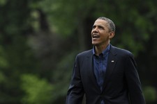  - 
              President Barack Obama talks to family members standing on the Truman balcony of the White House as he walks from Marine One on the South Lawn after returning to Washington, Sunday, Jun