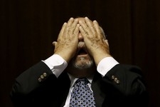  - 
              Rep. Macario Saldate, D-Tucson, rubs his eyes during a special session budget battle for Medicaid funding on Wednesday, June 12, 2013, in Phoenix.  The Arizona Legislature is on track t