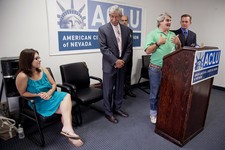  - 
              Surrounded by attorneys, James Brown, second from right, talks during a news conference, Wednesday, June 12, 2013, at the ACLU headquarters in Las Vegas, about currently living with his