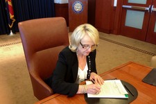  - 
              In this photo provided by by Ariz. Rep. Jeff Dial, Gov. Jan Brewer signs a proclamation calling the Legislature into special session, Tuesday, June 11, 2013, in Phoenix. Brewer acted af