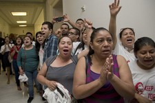 - 
              People shout out against the Strengthen and Fortify Enforcement Act in the hall outside the House Judiciary Committee hearing on Capitol Hill in Washington, Tuesday, June 18, 2013. The 
