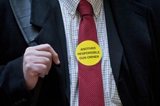  - 
              Jeff Soracco of Oxford, Conn. wears a sticker identifying him as a responsible gun owner as he waits to sign up to speak at a hearing of a legislative subcommittee reviewing gun laws at