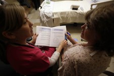  - 
              This photo taken Jan. 30, 2013 shows patient Marlena Bechtel-Rysdam, right, from Elgin, Ore., going over home monitoring training materials with registered nurse Christina Leese at Oreg