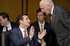  - 
              FILE - In this Jan. 30, 2013 file photo Senate Judiciary Committee member Sen. Ted Cruz, R-Texas, left, talks with committee Chairman Patrick Leahy, D-Vt., during a hearing about gun vi