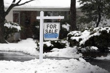 - 
              In this Wednesday, Feb. 27, 2013 photo, a for sale sign hangs outside a home in Glenview, Ill. Average U.S. rates on fixed mortgages were little changed the first week of March, hoverin