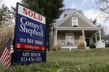  - 
              In this, Tuesday, March 12, 2013, photo, a sold sign is posted in front of a home for sale in Mariemont, Ohio. Average U.S. rates on fixed mortgages edged up this week but remained near