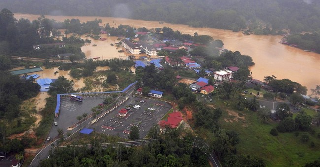 Malaysia PM cuts short holiday to deal with floods - AP News 12/26.