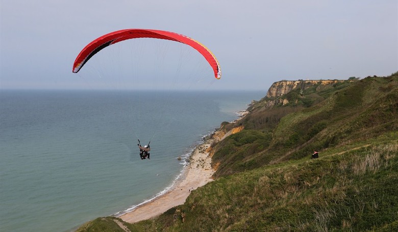 Insane Video: Sightseeing Plane Cuts Woman's Paragliding Lines Mid-Air, but She Lives to Tell the Tale