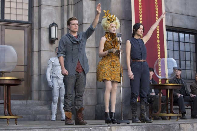 FILE - This image released by Lionsgate shows, from left, Josh Hutcherson as Peeta Mellark, Elizabeth Banks as Effie Trinket and Jennifer Lawrence as Katniss Everdeen in a scene from t