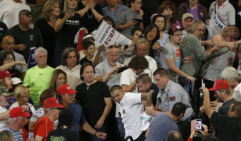 Anti-Trump Protesters Break Down Barrier, Light Fires, Throw Rocks at Police