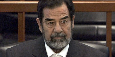 Michigan Senate Hopeful’s Dad on Board of Charity That Funded Saddam Hussein