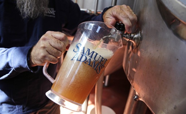 Master brewer Bob Cannon, of the Samuel Adams Boston Brewery, pours a pitcher of their "80-Miles of Helles" beer, which is made using water from Boston's Charles River, Thursday, Sept.